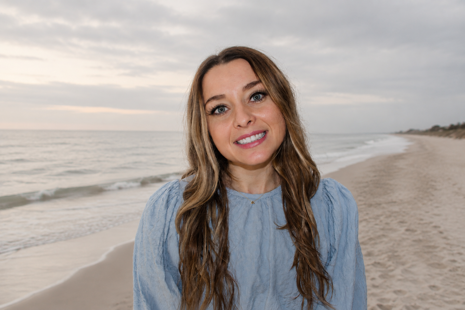 Jessica Prosser, Licensed Professional Counselor, standing at the beach