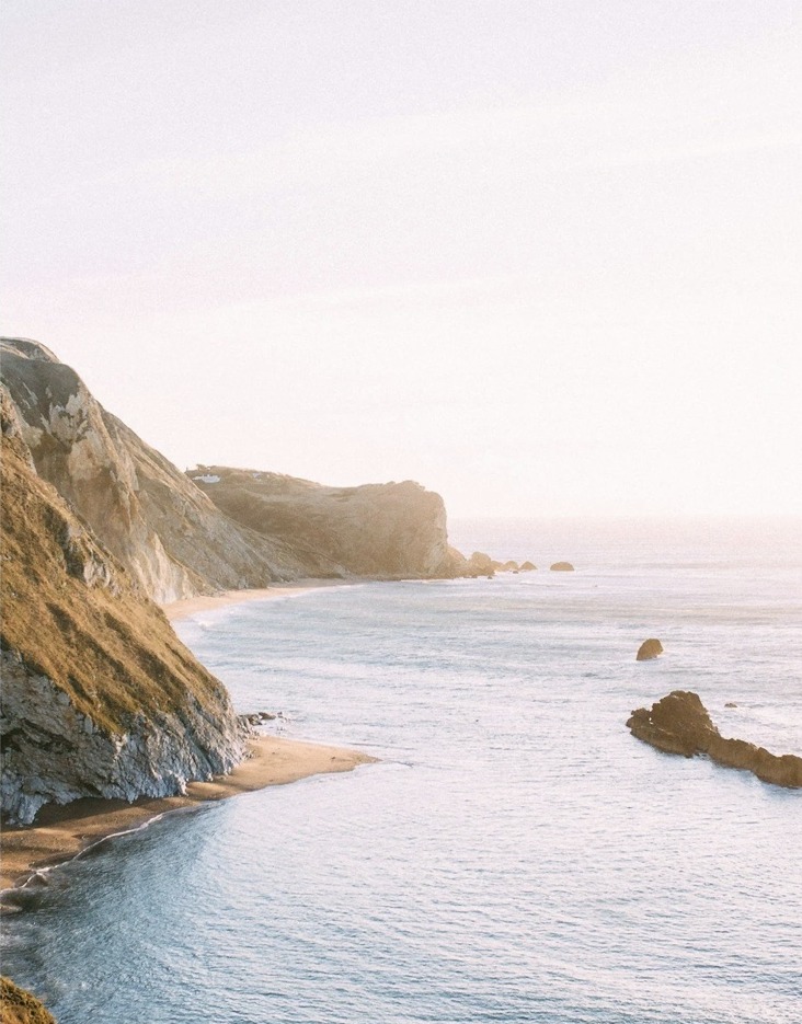 Coastal cliffs and ocean in soft morning light